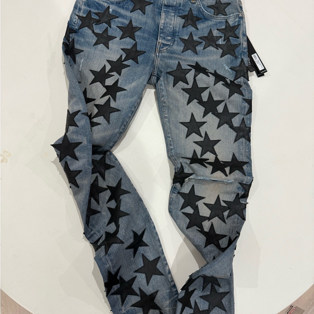 AMIRI Blue Jeans with Black Star Design